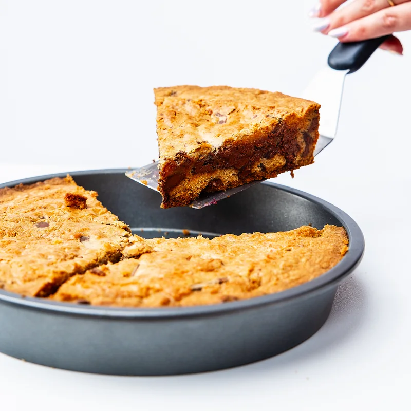 A thick golden pie slice with a chocolate-filled center
